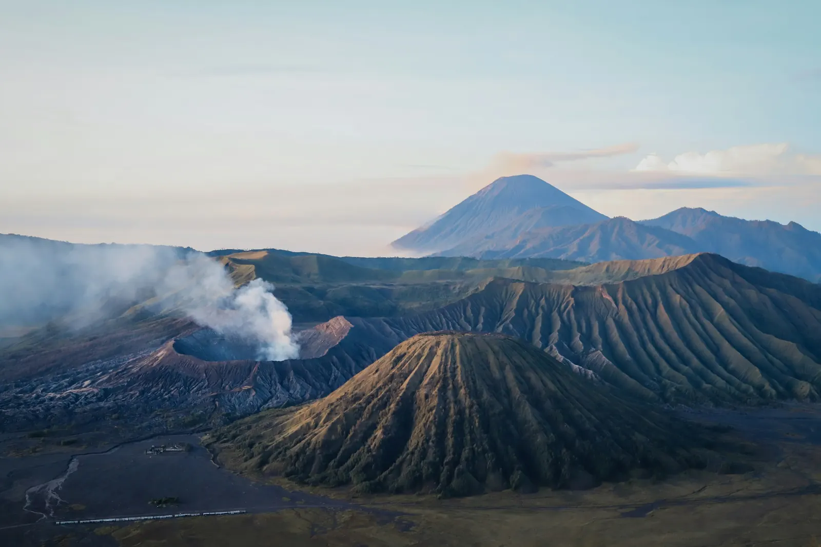 Steam rising from the active Bromo crater beside Mount Batok
