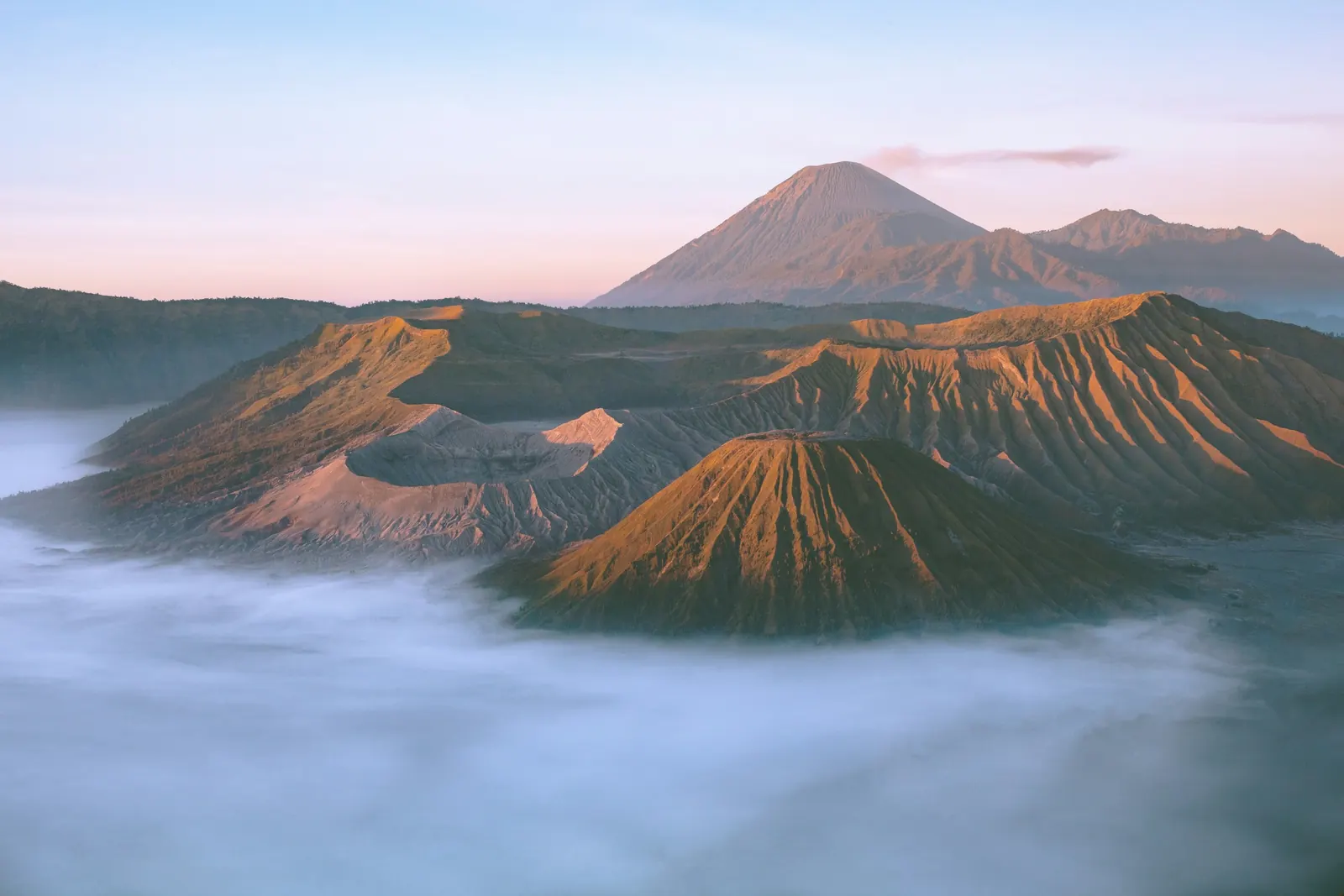 Pink dawn over the Tengger caldera, Mount Batok rising from the morning mist
