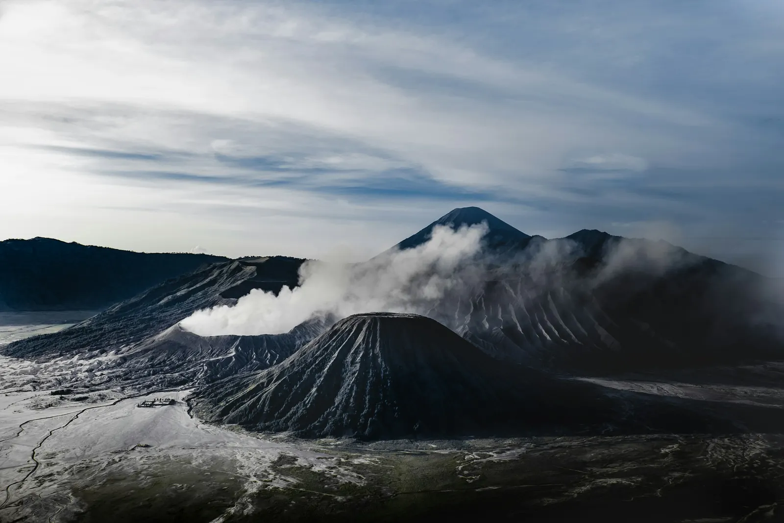 Mount Bromo venting beside Mount Batok, seen from above the caldera